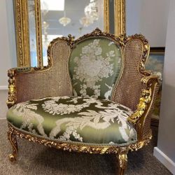  Rococo chase  LOOK UP A Rococo-style gilded wood chase with damask upholstery and caned sides. TIME PERIOD 19th Century Revival ORIGIN France ESTIMAT
