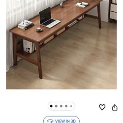 Solid wood mid century modern writing desk, 63 inches wide, perfect for a home office or workspace.