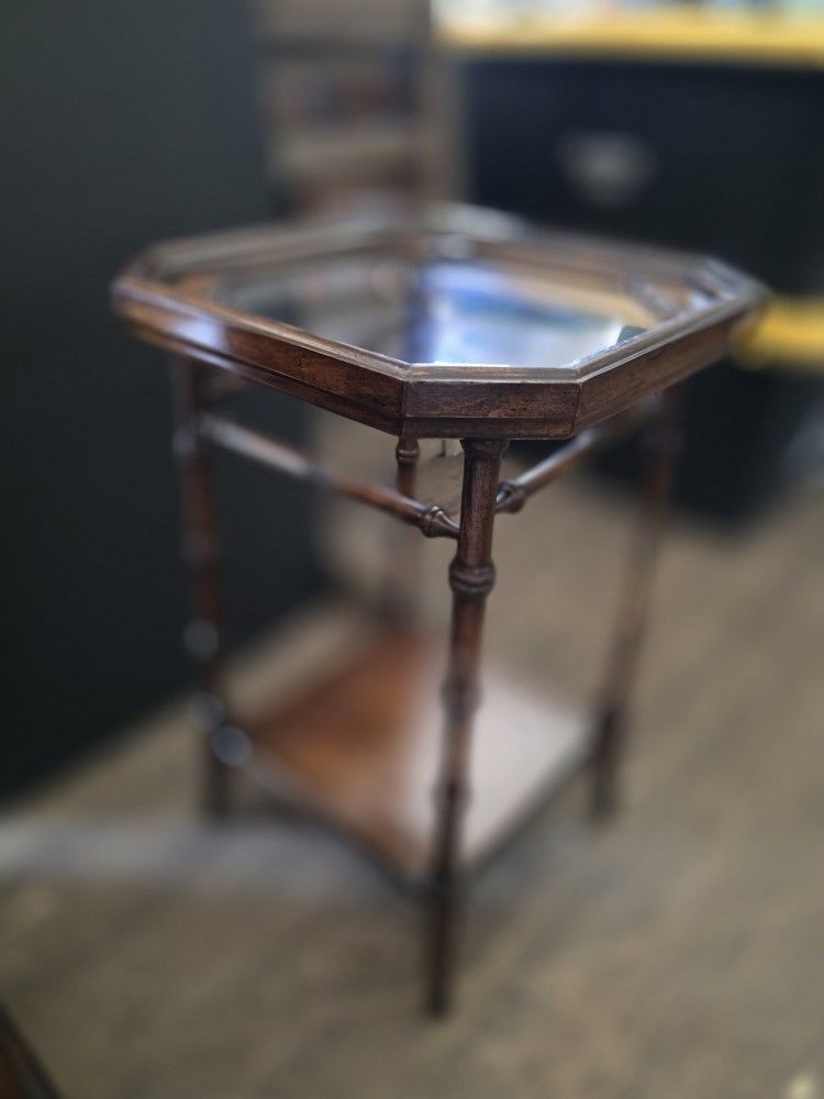 faux bamboo side table with a glass top