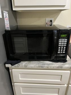MICROWAVE  21"w x 14 3/4"deep x 12"high; cross streets are Arapaho & Waterview