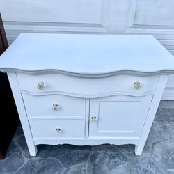 White 3-drawer dresser w/ storage cabinet . Good condition. Measurement: 3-drawer w/ cabinet:  32 1/2L x 19 deep x 27H.