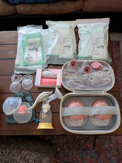 Momcozy M9 Breast Pump and breastfeeding accessories