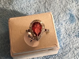 925 pear shaped ruby and white topaz ring size 7.