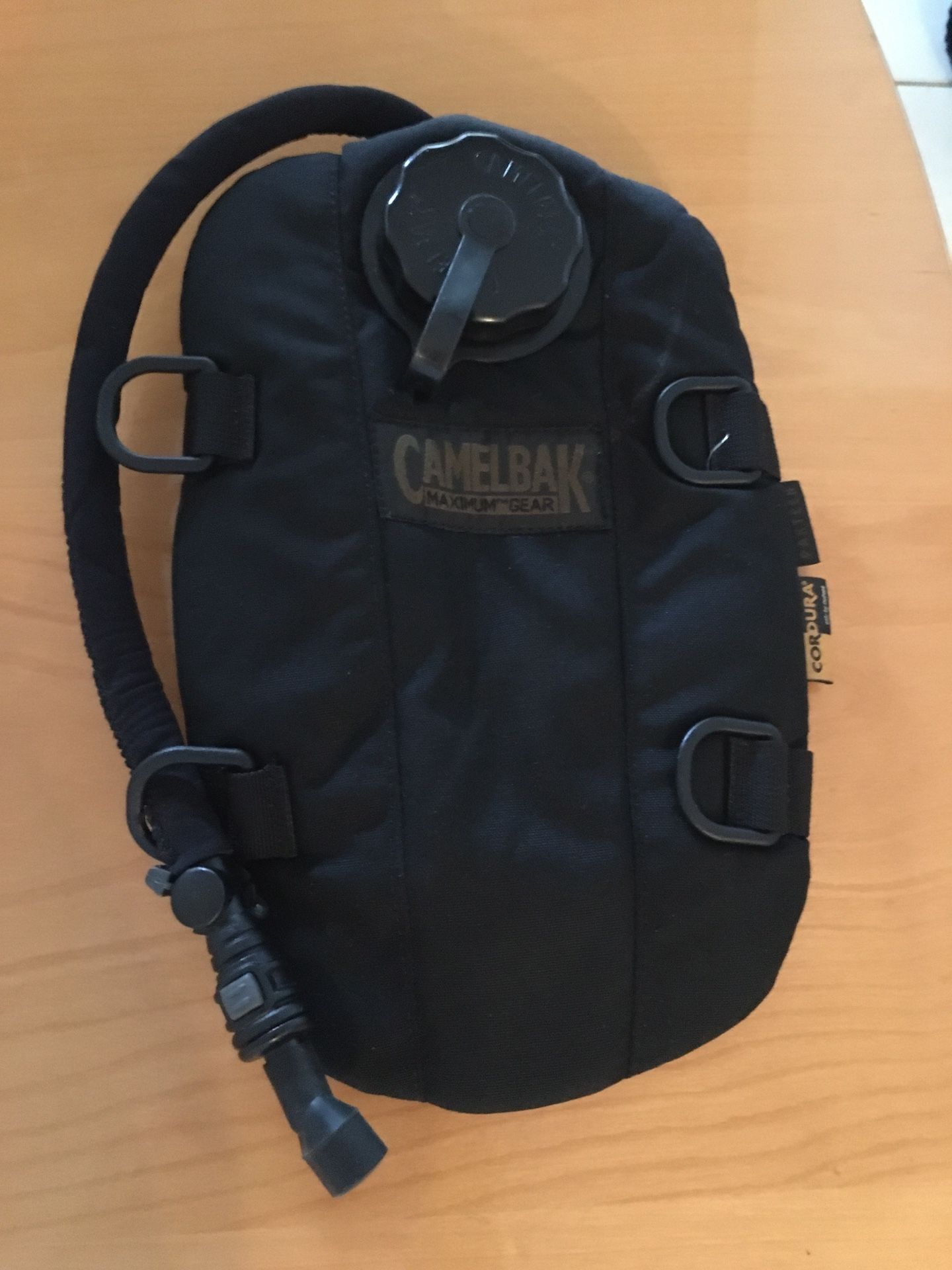 New CamelBak Pakteen 1.5L Hydration Pack, designed for carrying water. It is made of durable 1000D Cordura fabric and a 1.5-liter water reservoir