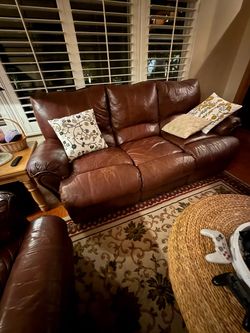 Mathis Home Leather Manual Recliner Brown Sofa and Loveseat