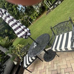 Cast aluminum garden chairs, table, umbrella and cushions