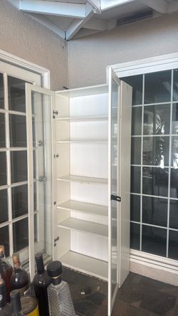 Tall White Cabinet with Glass Doors