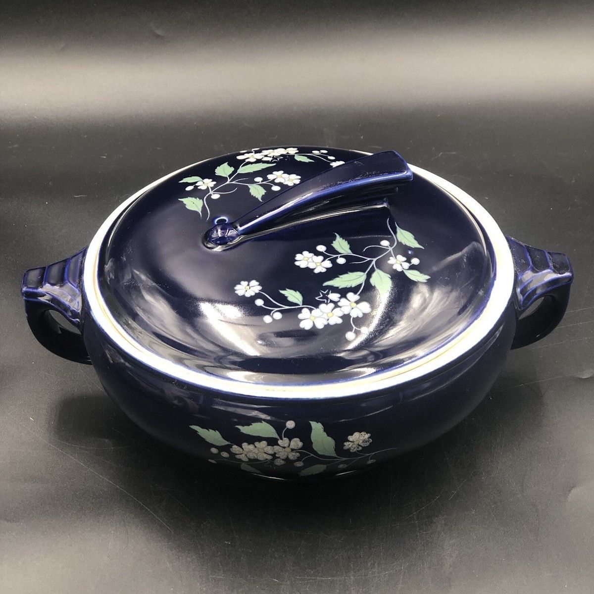 Hall China cobalt blue "Satellite" casserole with floral pattern and sundial handle.