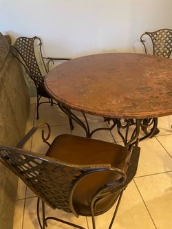 wrought iron / stone table