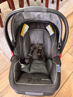 Graco SnugRide SnugLock infant care seat with base.
