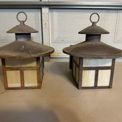 Two metal outdoor wall lighting fixtures