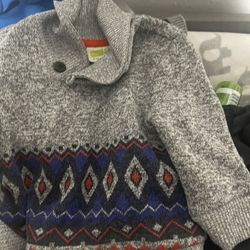 Boxes of kids and baby clothes 