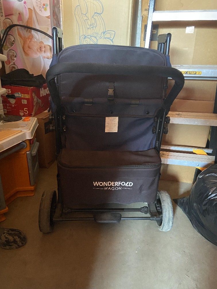 It’s a Wonderfold W4 Elite Quad Stroller Wagon