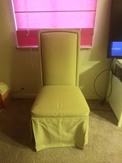 2 TAN ARMLESS CHAIRS ON CASTERS w/2 SETS of CHAIR COVERS!!