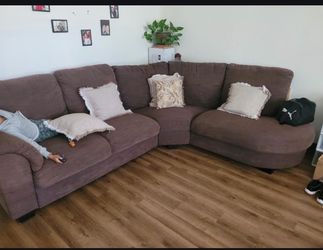 Brown L shape couch