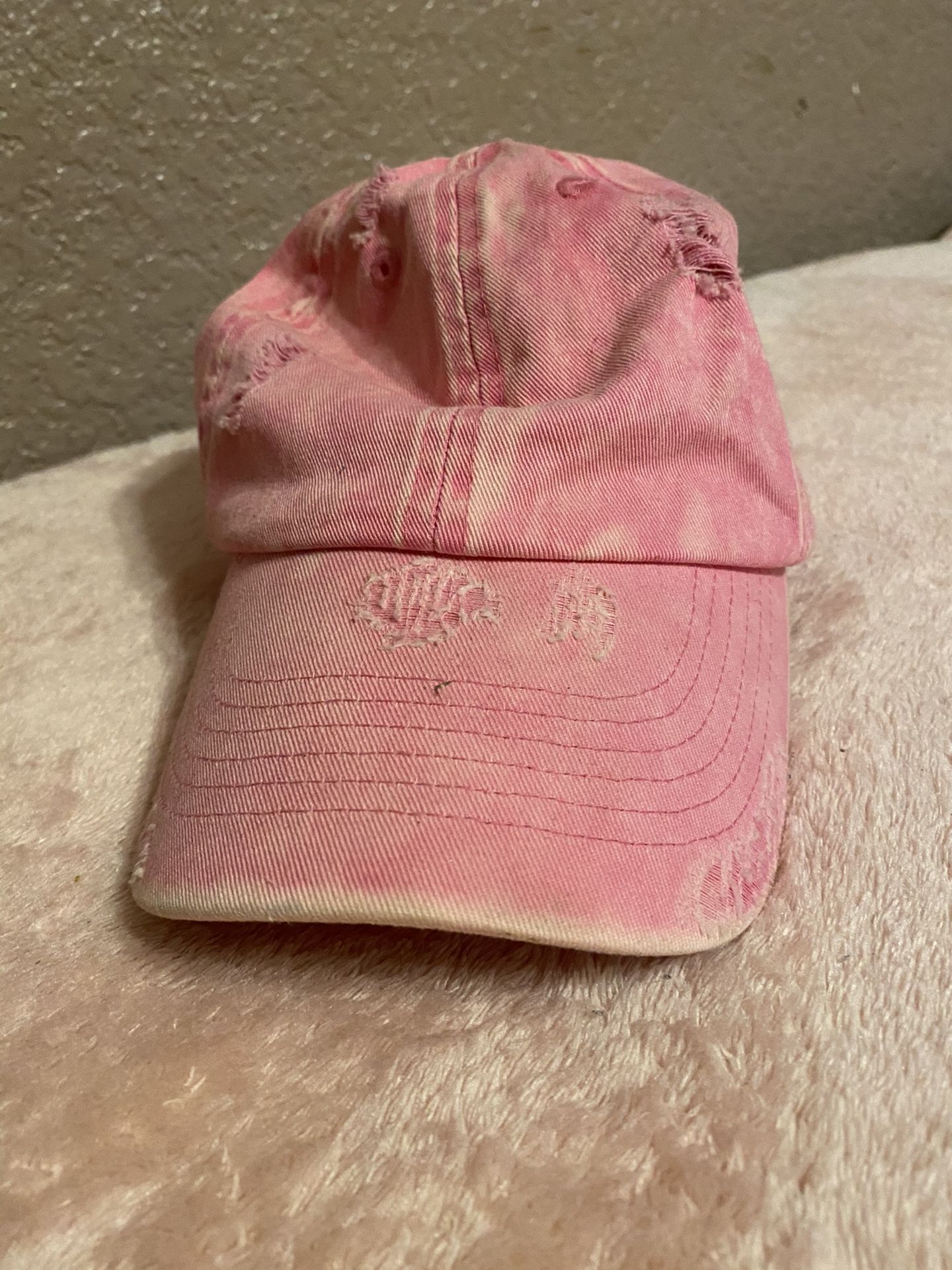 TORN PINK HAT