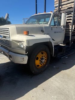 2 flat bed trucks / 2 trokes..