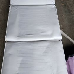 Portable massage table or an esthetically treatment bed topper.