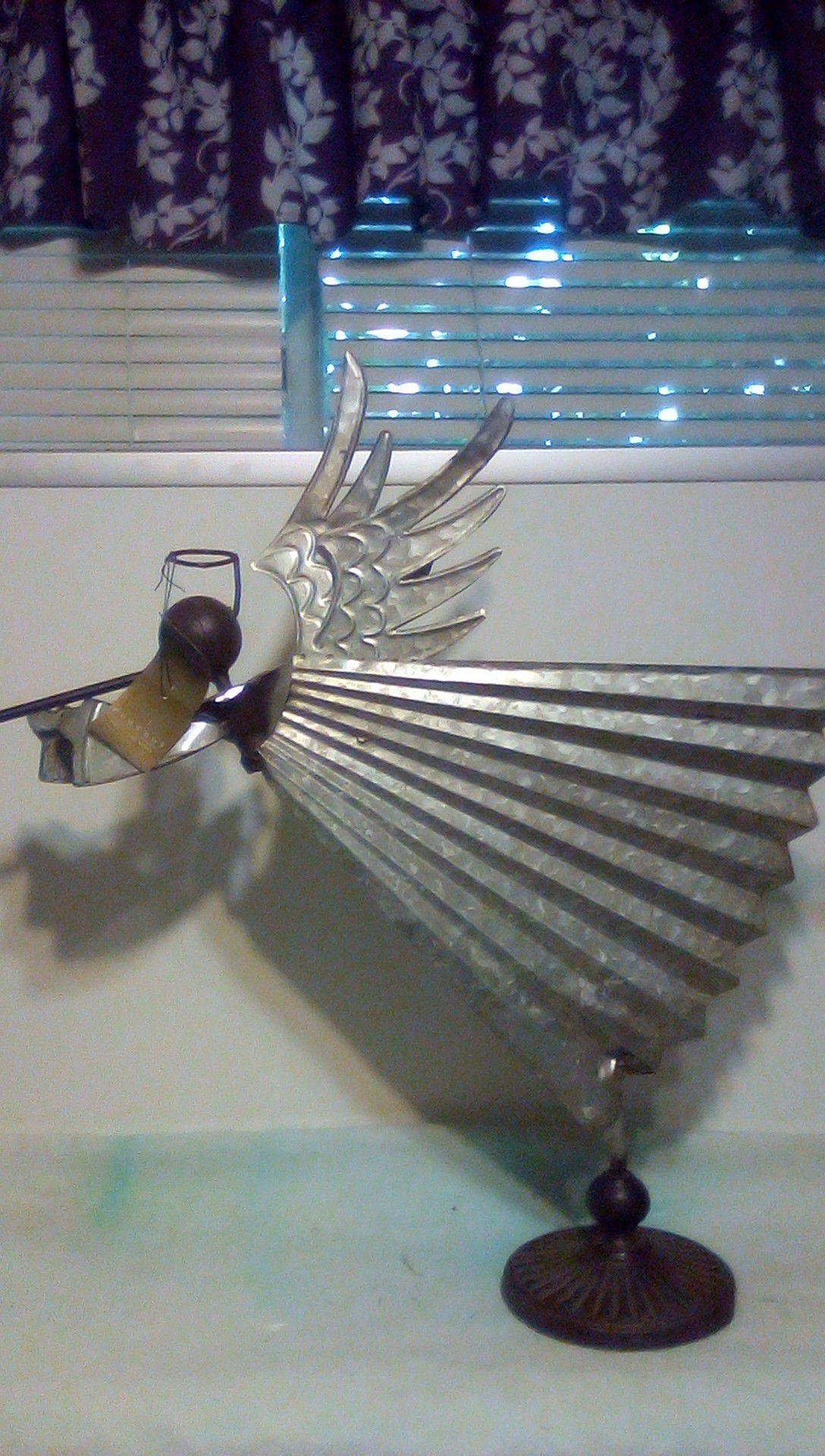 Metal angel decoration. Approximately 26 in tall by 28 in wide