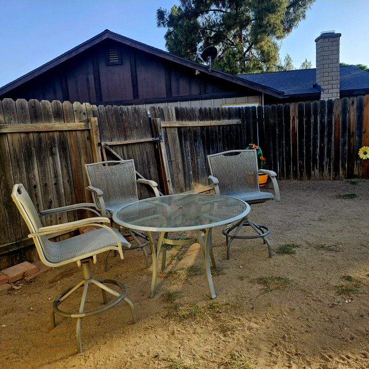 3 Chairs And A Table,