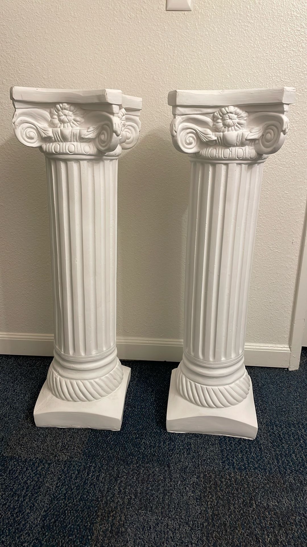 Two tall white pillars/columns
