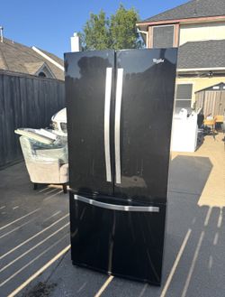 Whirlpool French door refrigerator in a black finish.