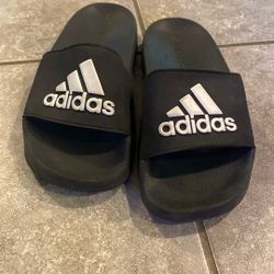 All black Adidas slippers