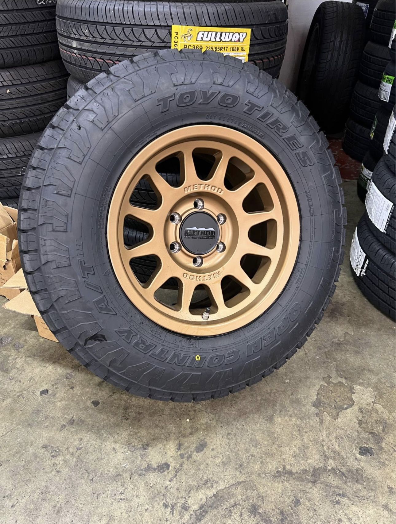 Method MR703 Bronze Wheels 265/70R17 Toyo Open Country ATIll Tires Package Deal, WE FINANCE
