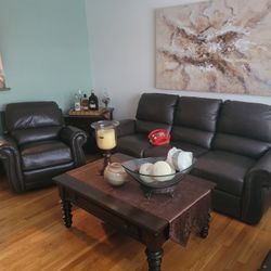 Jennifer's convertible 100 % leather sofa & Recliner. Two Wood Tables. 