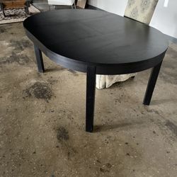 Solid Circle Wood Table With Leaf (shown With Leaf Inserted)