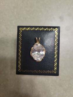 14 k gold pendant with cz . Weight is 6.1 grams