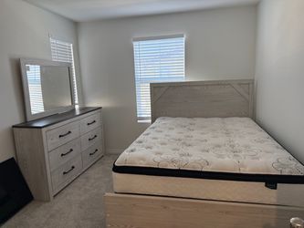 Queen bed with mattress and dresser Ashley furniture