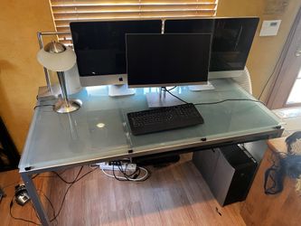 Glass desk with retracting keyboard tray