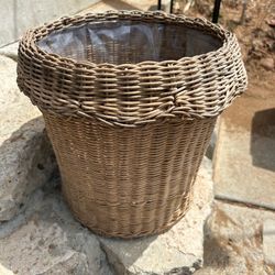 Wicker basket made into a plant pot.