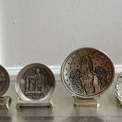 Lot of 4 mixed vintage pewter metal coin medallion with stands Las Vegas colonial Busch gardens the dark continent, Graceland Memphis, Lincoln memoria