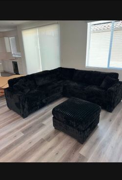 Black Sectional jumbo cordouy sifa with ottoman