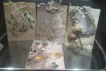 Gift bags /4 Designs -3set each totaling 12. Bags.(New)