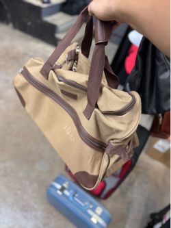 Vintage S Zone canvas rolling duffel bag with wheels.