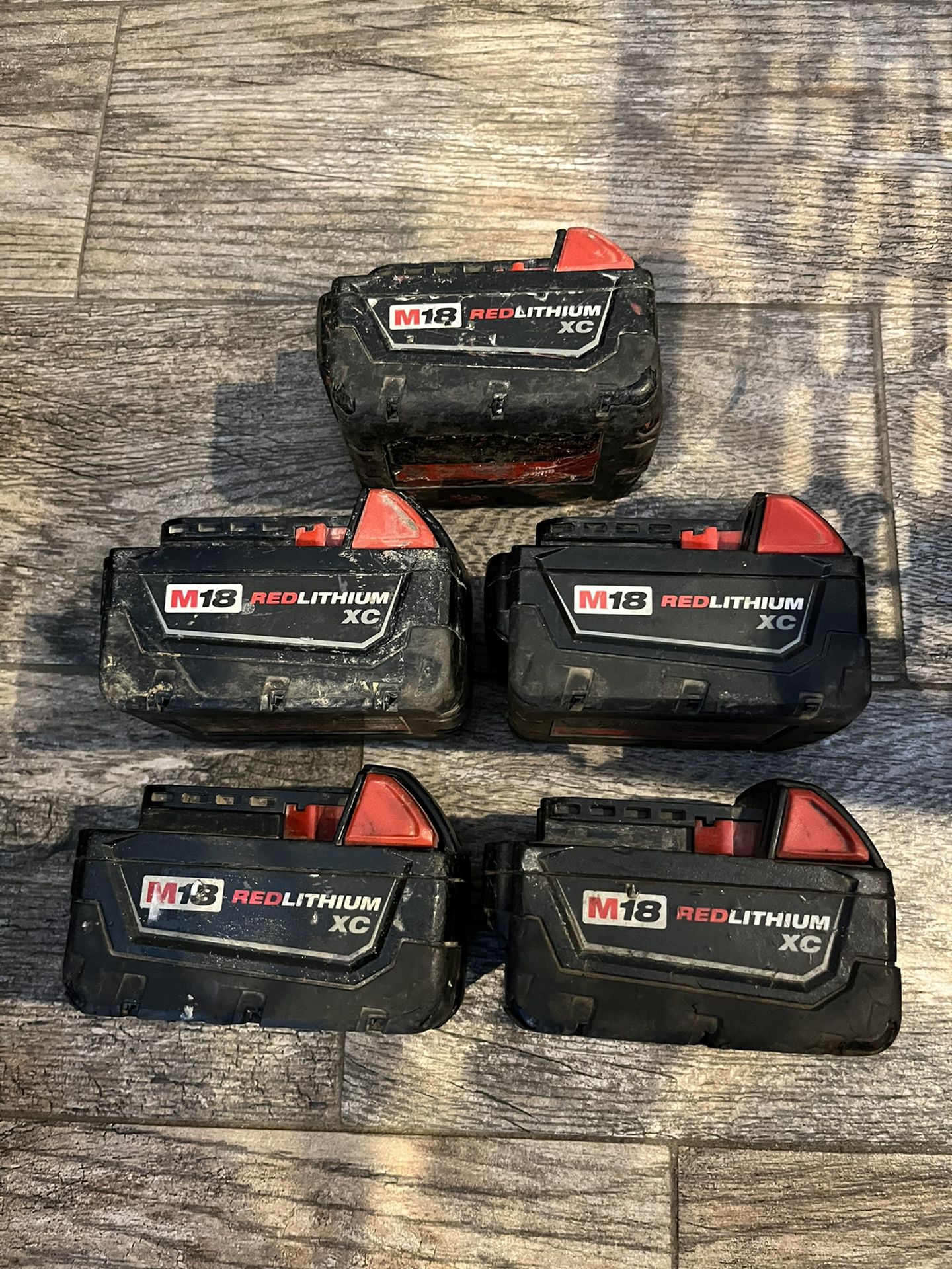 LOT OF (5) USED MILWAUKEE M18 RED LITHIUM XC 3.0 BATTERY PACK TOOL GENUINE OEM ORIGINAL  Stock Photo. The cosmetic condition will vary but the battery