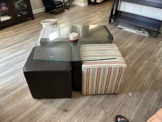 Square table with rolling ottomans