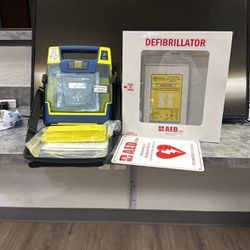Cardiac Science Defibrillator, Extra Battery, Wall Box And More 