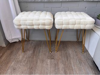 2 small white cushion stools with gold legs