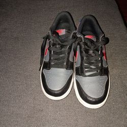 Black Gary and red Nike dunk lows