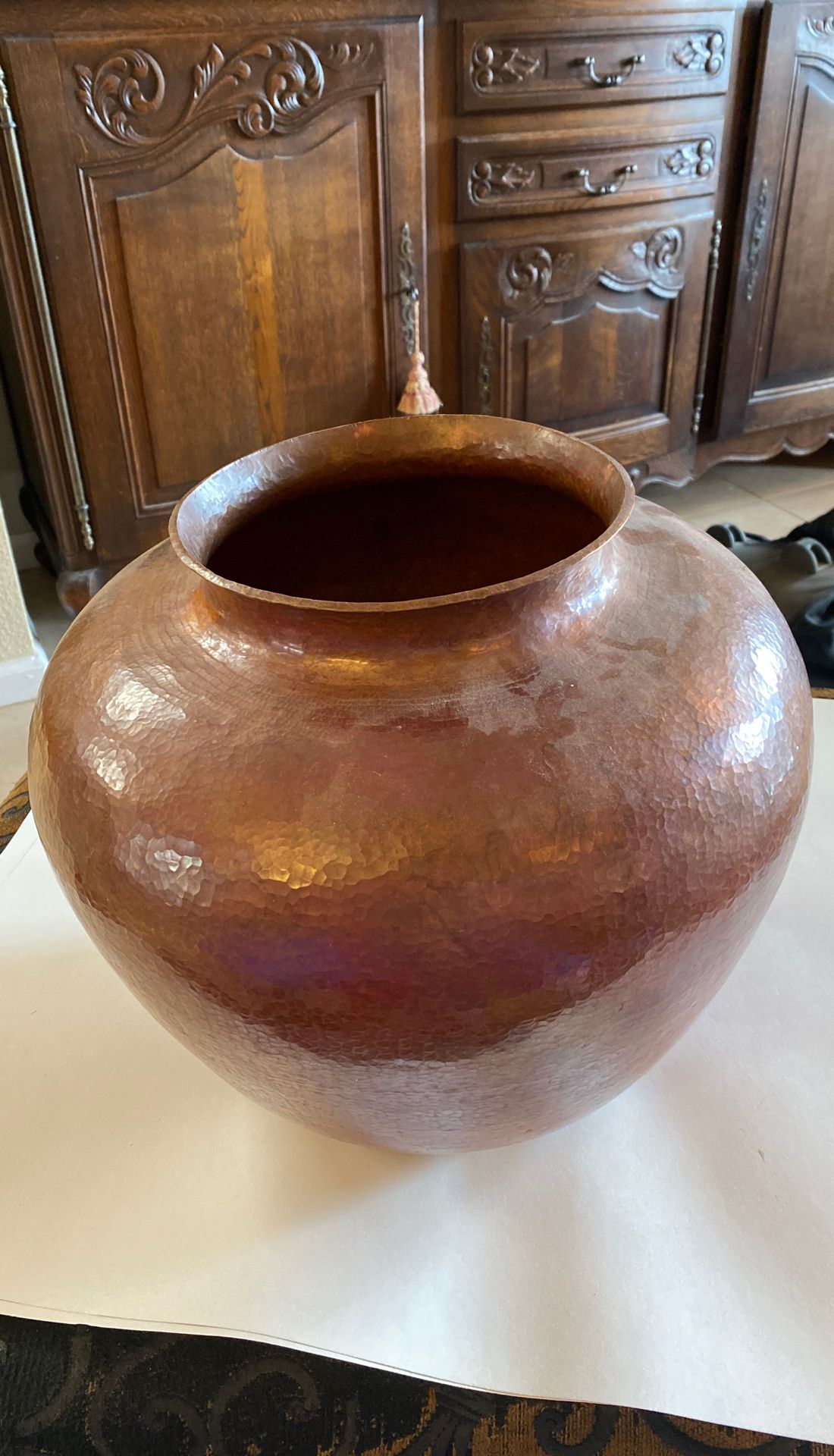 Copper decorative pot. 13” tall, 16” wide. Slight dent on back.