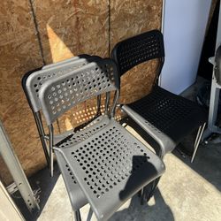 Plastic stackable chairs in black