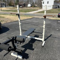 Weightlifting bench rack with barbell