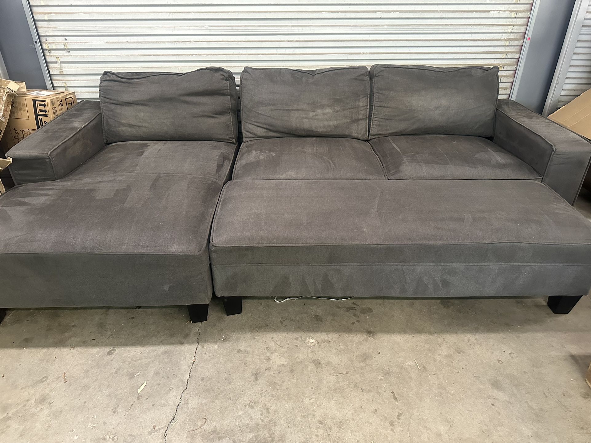 Three Piece Sectional With Storage Ottoman This was a customer return from a big box store. From a pet friendly home. Has great bones, just needs a l