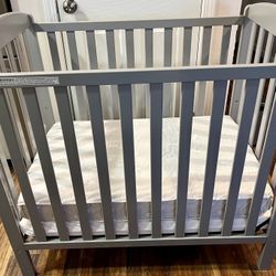 Delta Children Emery Mini Convertible Baby Crib with 2.75-inch Mattress, Grey