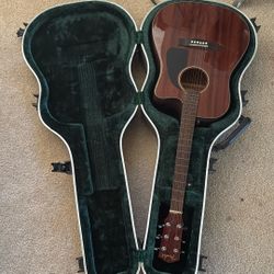 Fender acoustic guitar with matching case. 