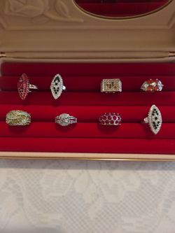 8 new assorted Rhodium plated rings